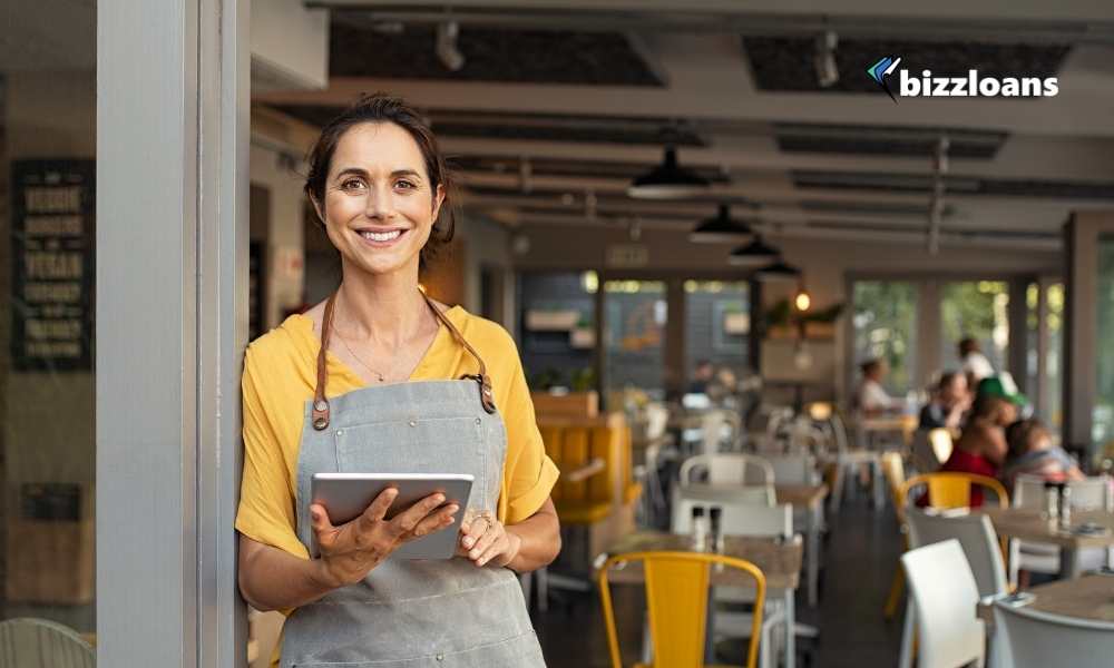 happy small business owner at entrance