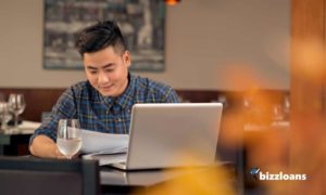 business man looking at documents - applying for business line of credit