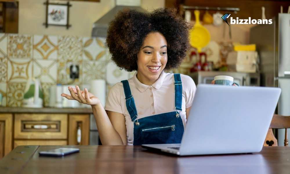 business owner working and talking on laptop