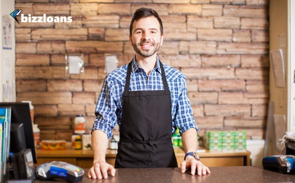 business owner smiling at the checkout counter