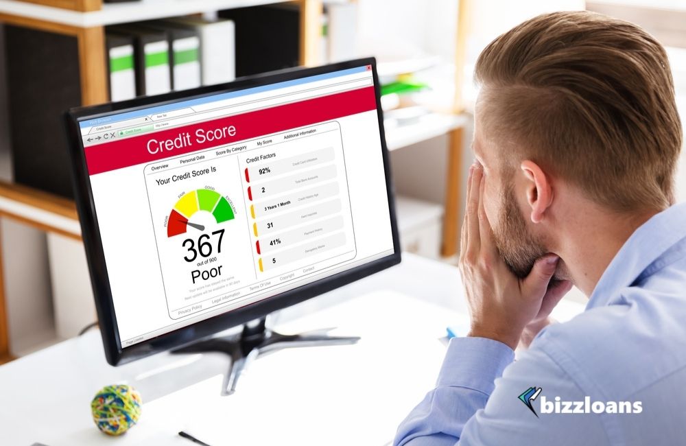 business man looking at his Poor Online Credit Score Rating On Computer
