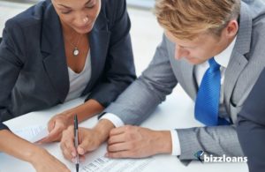 two businesspeople making a cash flow forecast