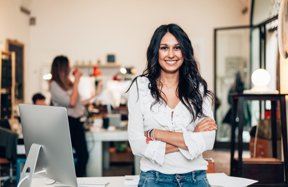 happy business woman in her shop