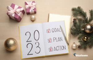 Flat Lay Composition of Notebook with Text 2023 Goal, Plan, Action